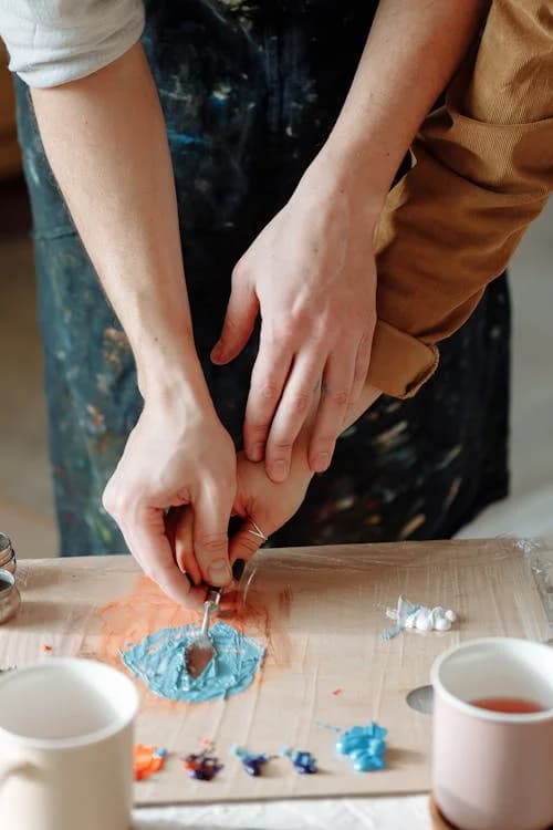 Hands painting during an art therapy activity